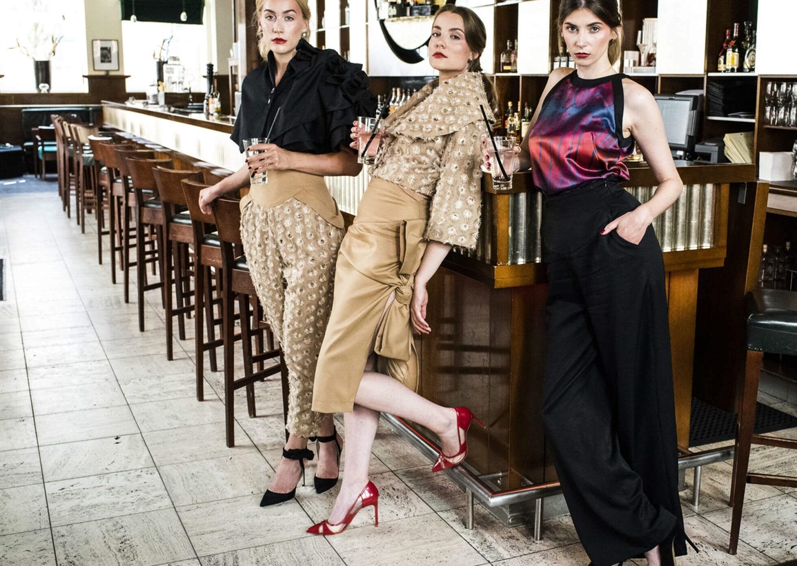 Three girls in cocktail attire